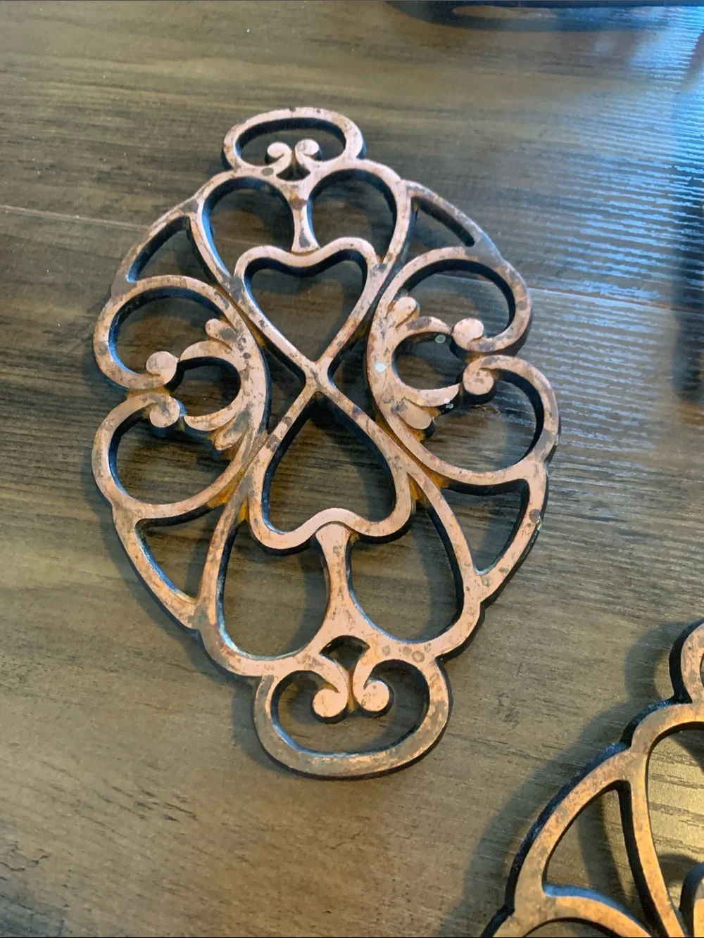 The Pampered Chef Copper-Tone Ornate Trivet Set.